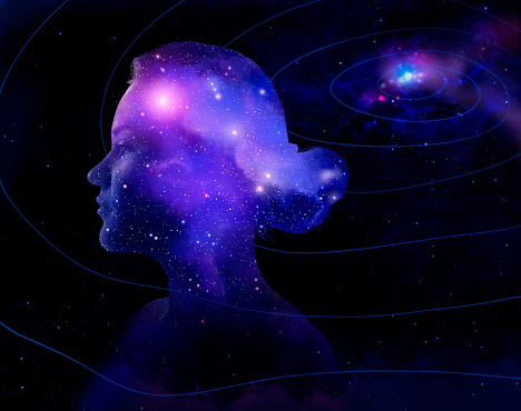 Photo compilation of woman's head as a part of the universe, connecting with the source.