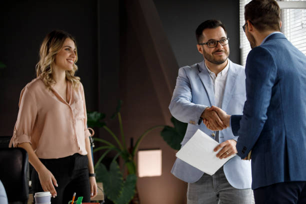 istock Two businessmen shaking hands after successful meeting 1313645624