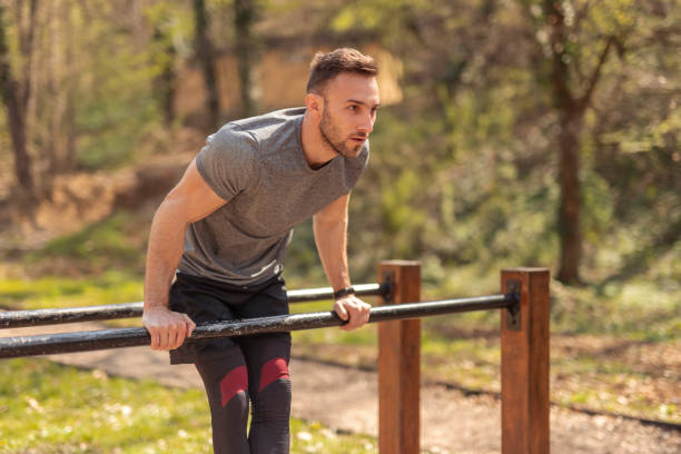 istock Man having a training session in a street workout park 1313648902