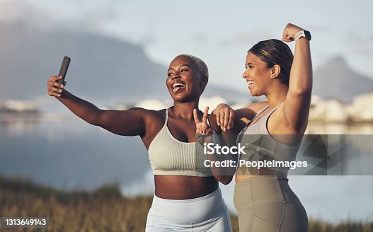 istock Shot of two women taking a selfie while out for a run
together 1313649143