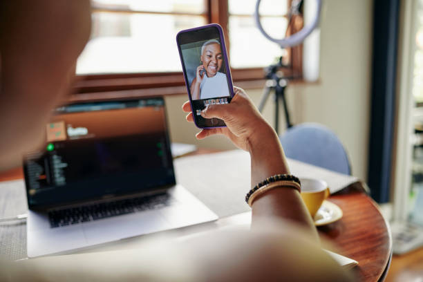 istock Young African influencer taking a selfie while working on a laptop 1313649346