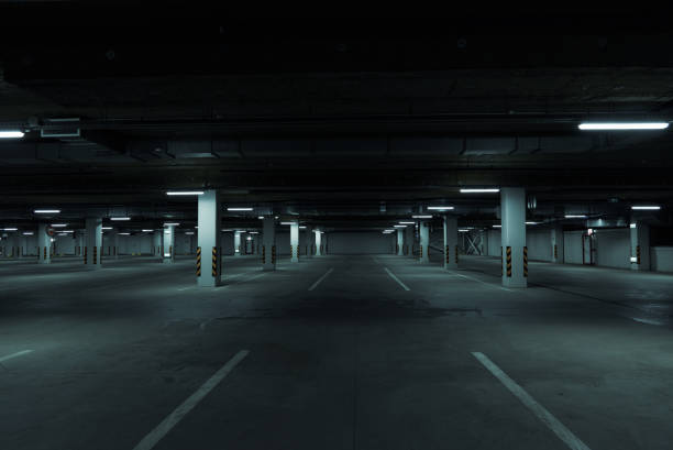 istock Horizontal image of dark underground parking lot 1313651923