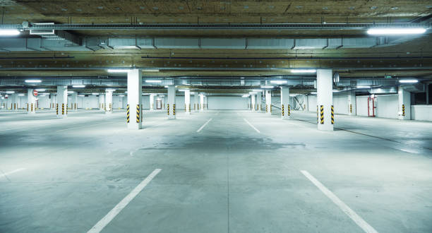 istock Horizontal image of clean white underground parking lot 1313651964
