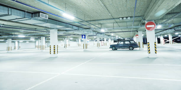 istock Horizontal image of clean white underground parking lot 1313651965