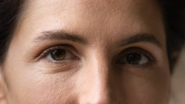 istock Young dark haired female face with natural makeup on eyes 1313653239