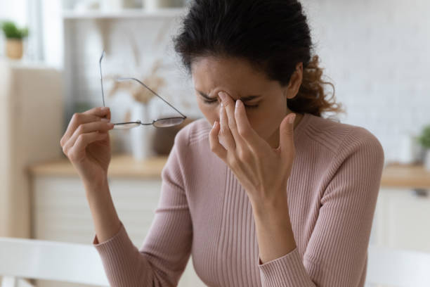 istock Sad millennial latina female take off spectacles massage nasal bridge 1313653775