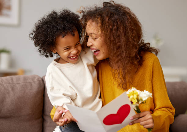 istock Young mixed race woman getting congratulations from son on Mothe 1313655087