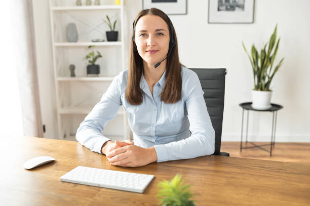 istock A female with a headset in the office 1313656314
