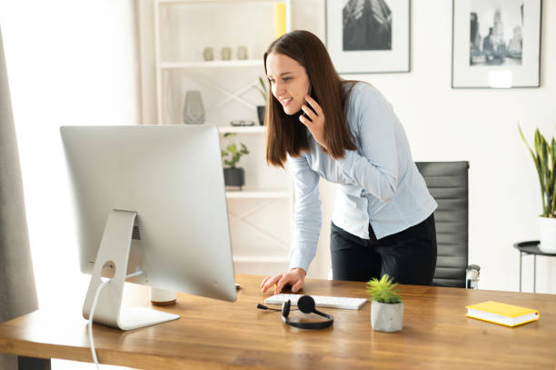istock A young woman is using PC in the office 1313656327