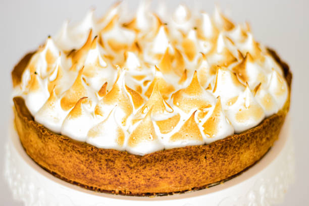 istock lemon pie. Lemon meringue tart with a biscuit base 1313656575