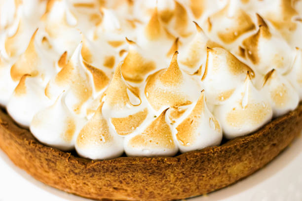 istock lemon pie. Lemon meringue tart with a biscuit base 1313656615