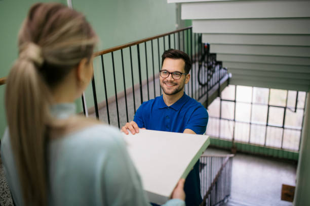 istock High angle view of a young Caucasian pizza delivery man at work 1313656747