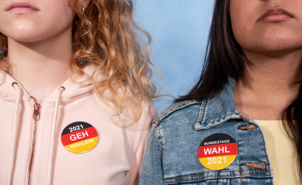 Close-up of two young women with election buttons on their clothes. Statement: "2021 Geh Wählen" (2021 Go Vote) and "Bundestagswahl 2021" (Federal Election 2021). Federal election Germany. german federal elections photos stock pictures, royalty-free photos & images
