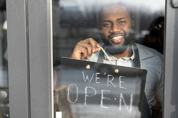 istock An African-American cafe owner with open sign 1313659319