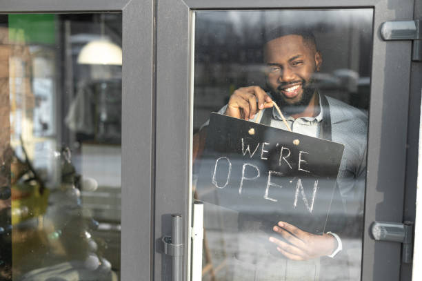 istock An African-American cafe owner with open sign 1313659332