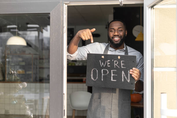 istock An African-American cafe owner with open sign 1313659342