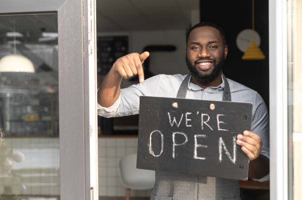 istock An African-American cafe owner with open sign 1313659353