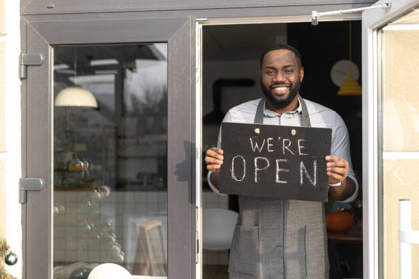 istock An African-American cafe owner with open sign 1313659362