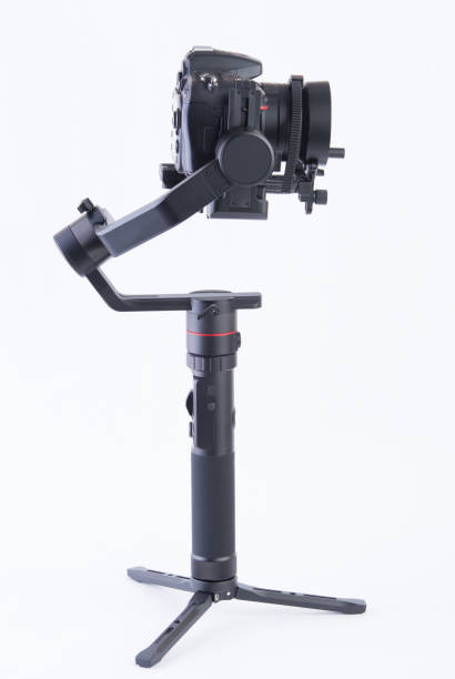 istock DSLR gimbal, professional camera stabilizer, white background, photographed in studio. 1313664318