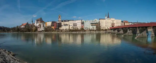 Medieval German city with romantic cozy alleys with old houses on the river bank, panoramic shot in sunny spring.