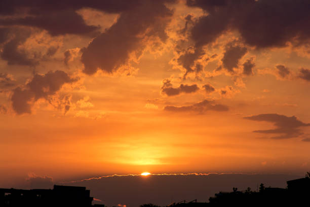 Sunset with sun almost hidden behind the clouds during summer in Sveti Vlas, Bulgaria