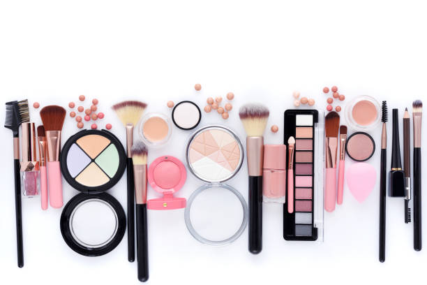 istock Makeup brushes and decorative cosmetics on a white background with copy space. Top view 1313668174