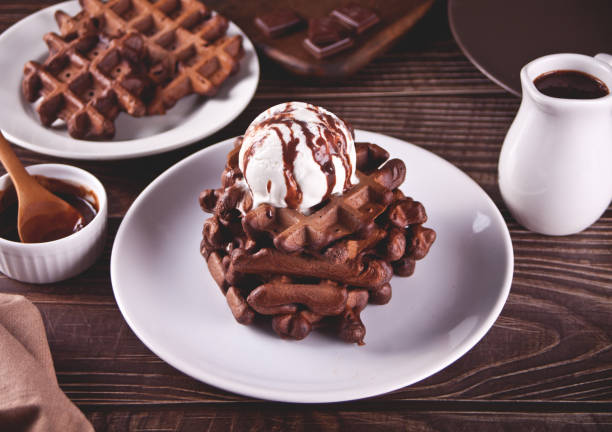 istock Homemade chocolate waffles with ice cream decorated chocolate syrup. 1313668531