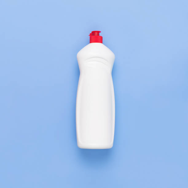 istock Eco cleaning detergent in white plastic bottle on blue background. Empty place for text or logo on pastel violet background. Household chemicals. Eco recycling cleaning product. Flat lay. 1313669641