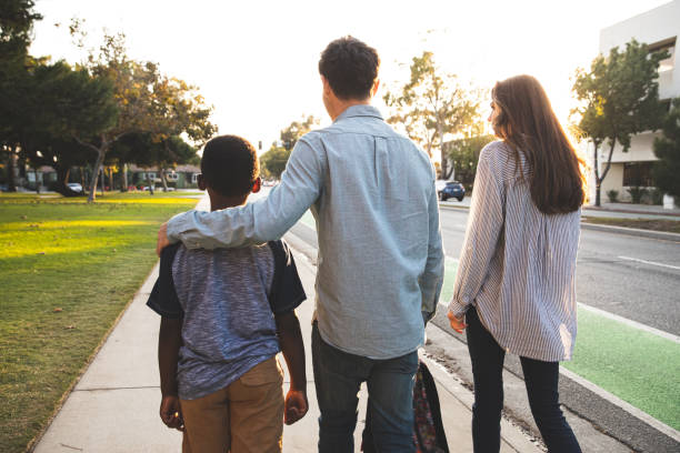 istock Family with little boy back from school 1313671525