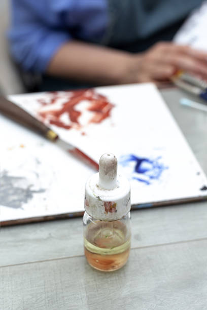 istock Unrecognizable woman hands working painting ceramic dishes 1313674158