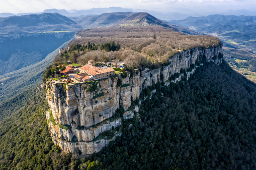 Aerial view with wide angle of the Sanctuary of El Far in the mountain of the Guilleries Massif, Catalonia, Spain