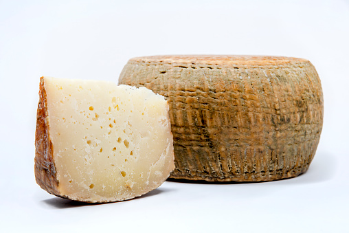 aged pecorino cheese in white background