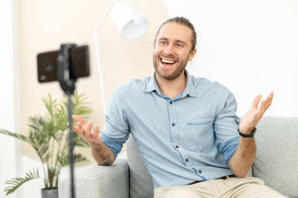 istock Happy hipster guy recording video for his blog 1313677458