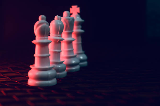 istock Traditional plastic chess pieces in a row 1313677910