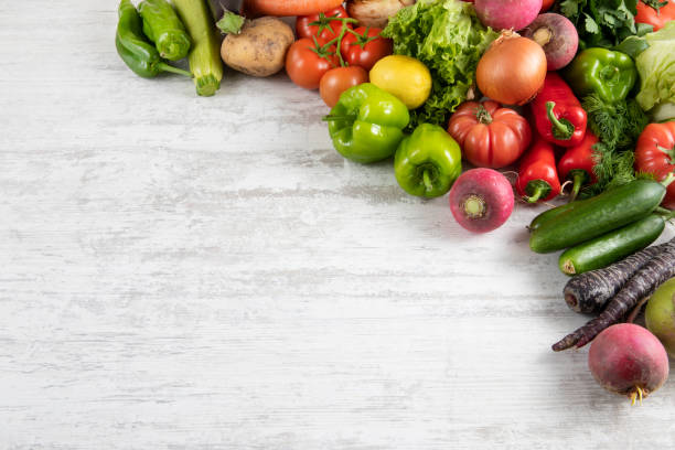 istock Fresh and Raw Vegetables on Wooden Kitchen Table 1313679075