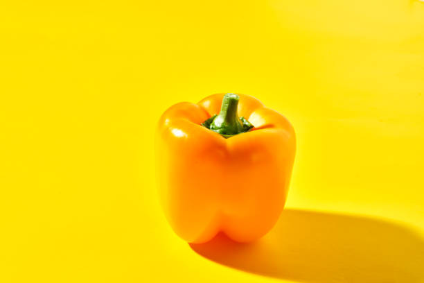Vegetable Concept Yellow Bell Pepper on Colored Vibrant Background
