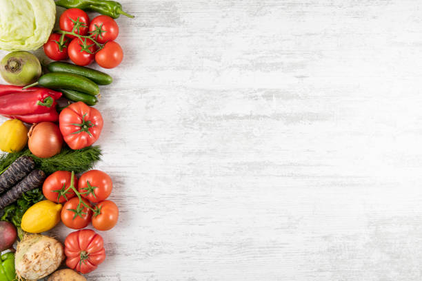 istock Fresh and Raw Vegetables on Wooden Background 1313679171
