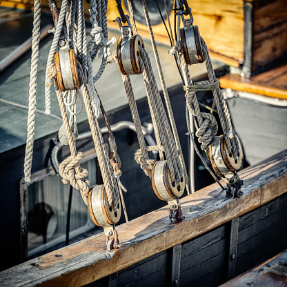 Wooden block pulley on old sailing ship.