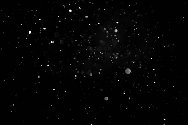 istock Defocused Snowing or raindrops on a dark background. Overlay 1313681528