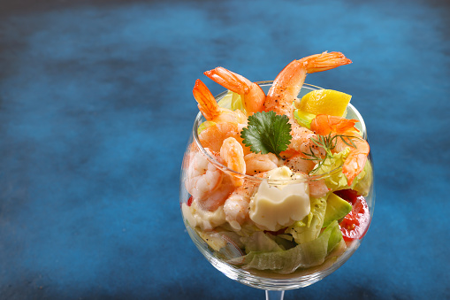 Stylishly prepared Thai styled spicy prawns with avocado and noodles served with chopsticks