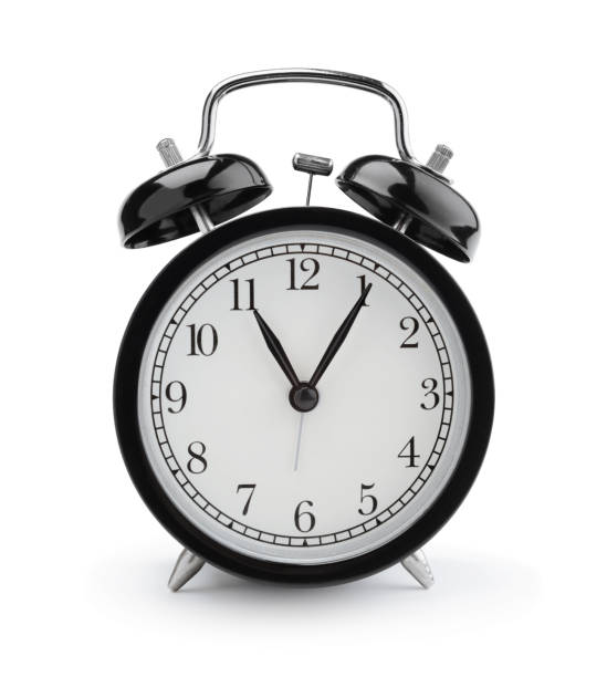 istock Vintage alarm clock isolated on white. 1313682219