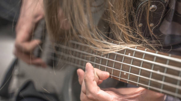 istock musician playing guitar, close up 1313685550