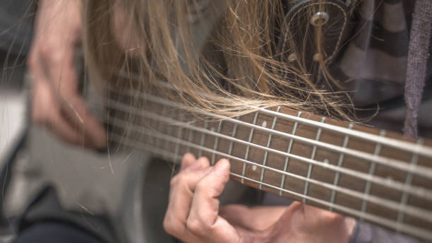 istock musician playing guitar, close up 1313686305