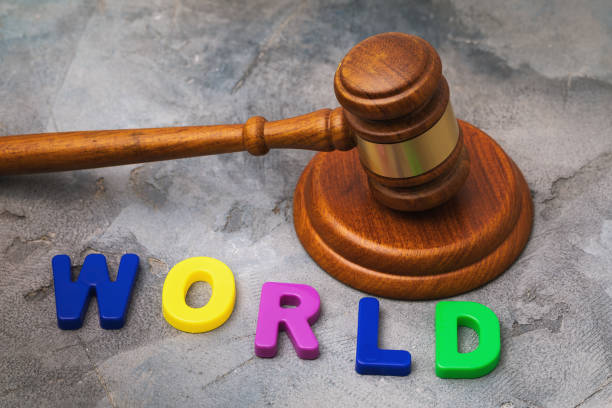 istock Judges gavel and letters from plastic on the table, world concept 1313686905