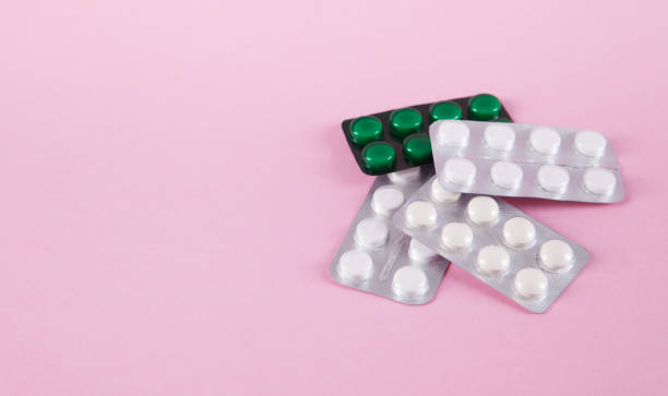istock Pills are isolated on pink background. 1313687929