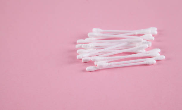 istock Cotton ear sticks, pink background. 1313688106