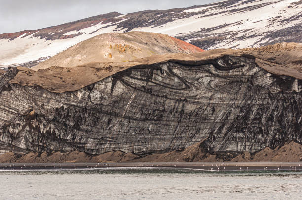 istock A large ice cliff from a Glacier with volcanic debris covering the surface at Baily Head, Deception Island, Antarctica 1313688411