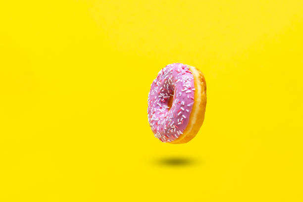 istock abstract sweet delicious donut isolated on color background 1313689804