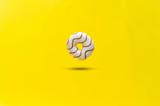 abstract sweet delicious donut isolated on color background