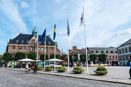 Lund, Sweden - August 30, 2019: Stortorget square with shops and people around in Lund, Scania, Sweden